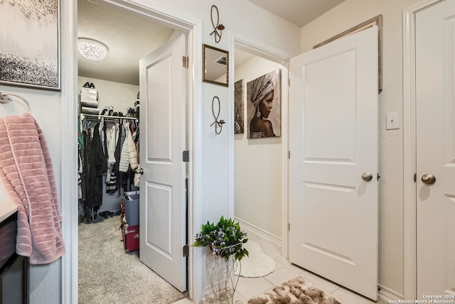 interior space with tile patterned floors and a textured ceiling