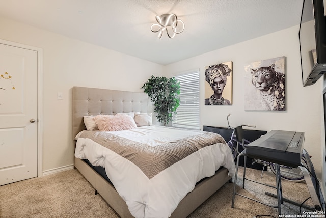 bedroom featuring light colored carpet