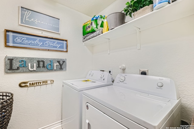 washroom featuring washer and clothes dryer