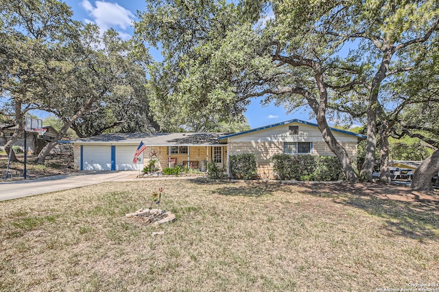 ranch-style home with a front yard and a garage