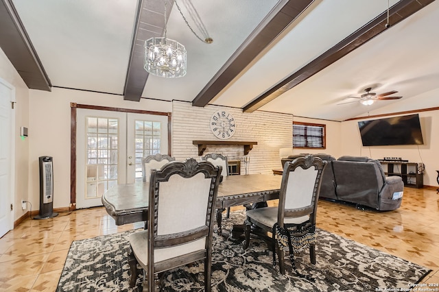 dining room featuring beamed ceiling, ceiling fan with notable chandelier, a fireplace, french doors, and light tile patterned floors