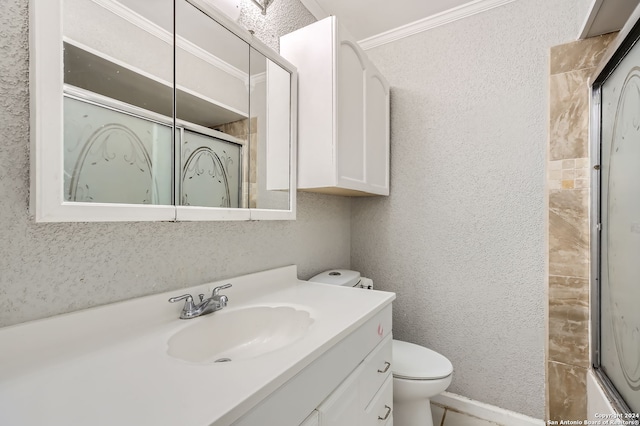 bathroom featuring walk in shower, vanity, crown molding, and toilet