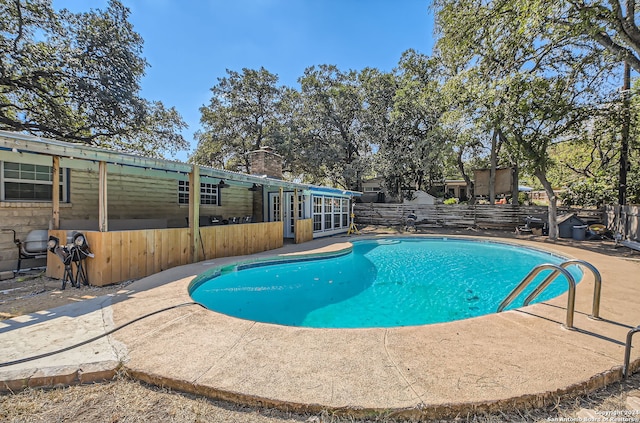 view of pool featuring a patio area