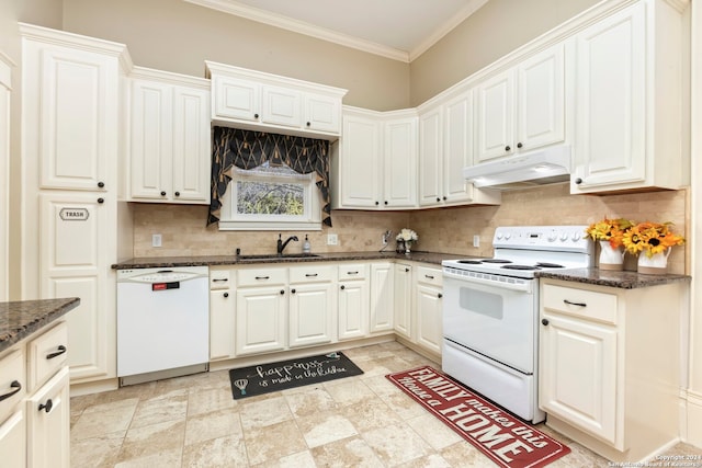 kitchen with white cabinets, white appliances, and decorative backsplash