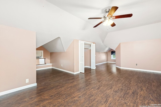 additional living space featuring ceiling fan, dark hardwood / wood-style floors, and vaulted ceiling