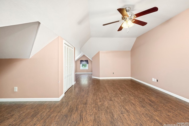 bonus room featuring lofted ceiling, dark hardwood / wood-style flooring, and ceiling fan