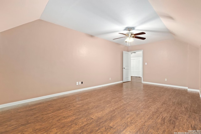 additional living space featuring lofted ceiling, hardwood / wood-style floors, and ceiling fan