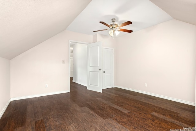 bonus room featuring ceiling fan, vaulted ceiling, and dark hardwood / wood-style flooring