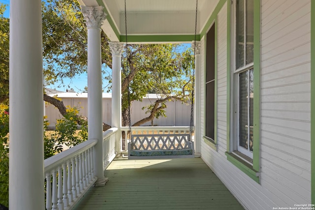 wooden terrace featuring a porch