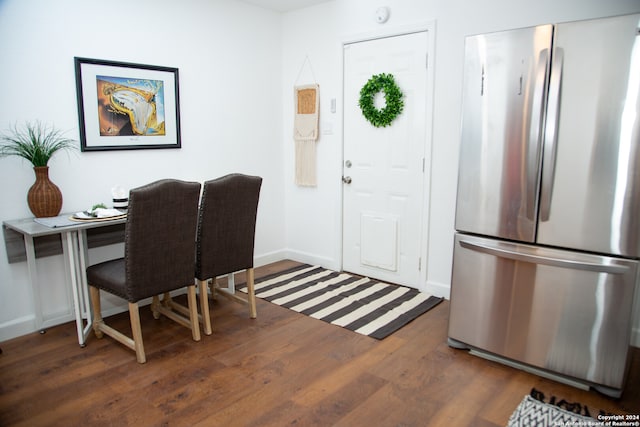 home office with dark hardwood / wood-style floors