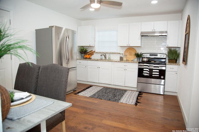 kitchen featuring light stone counters, stainless steel appliances, dark hardwood / wood-style floors, and white cabinetry