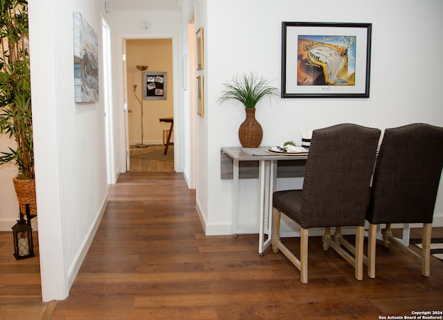 hallway with dark wood-type flooring