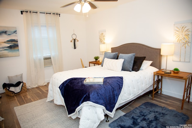 bedroom with ceiling fan and dark wood-type flooring