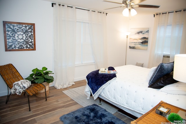 bedroom featuring ceiling fan and hardwood / wood-style floors