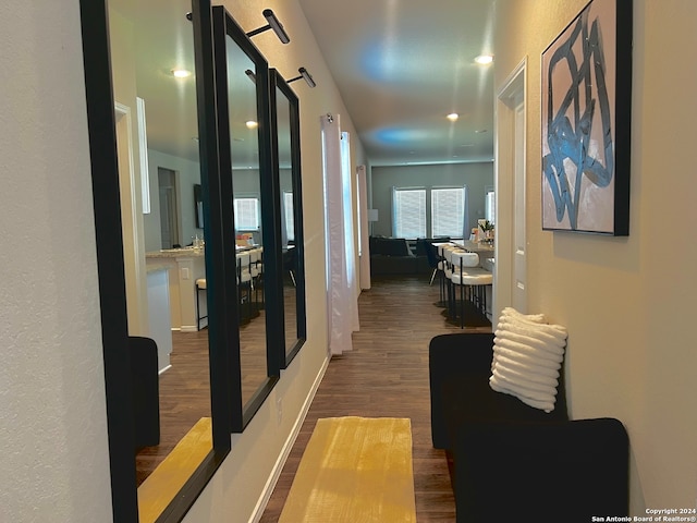 corridor with dark wood-type flooring