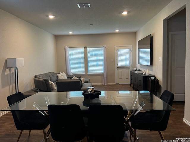 dining area featuring dark hardwood / wood-style floors