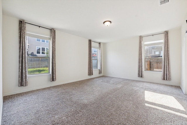 unfurnished room featuring carpet flooring