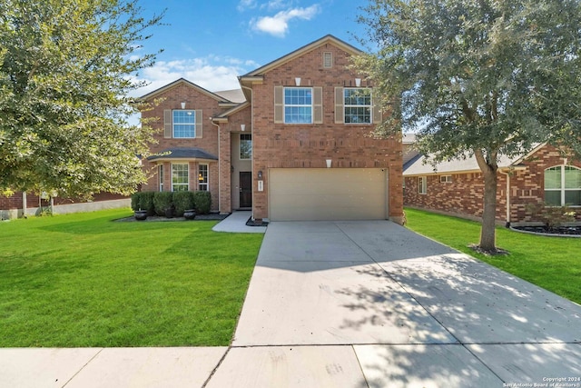 front facade featuring a front lawn and a garage