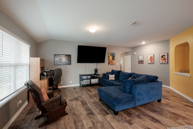 living room with lofted ceiling and dark hardwood / wood-style flooring