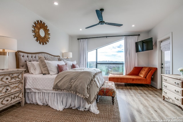 bedroom featuring light hardwood / wood-style flooring and ceiling fan