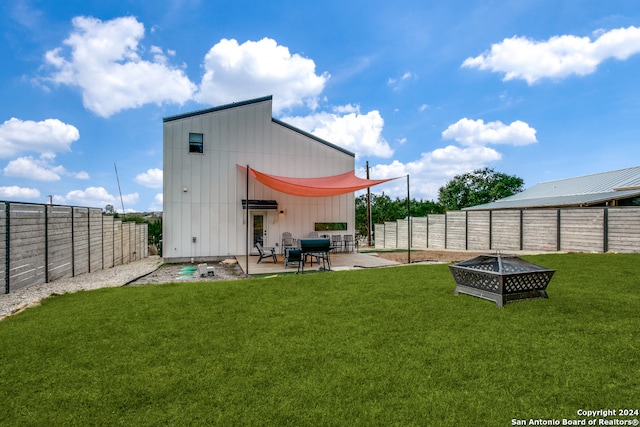 exterior space with a patio area and a fire pit