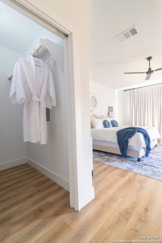 bedroom featuring hardwood / wood-style floors and ceiling fan