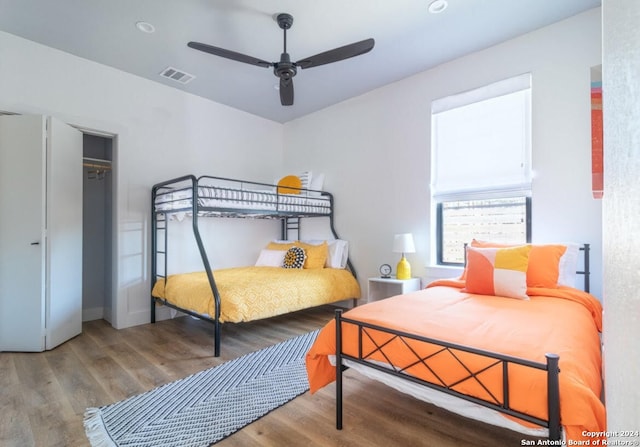 bedroom featuring a closet, ceiling fan, and hardwood / wood-style flooring