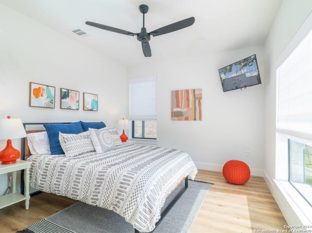 bedroom featuring hardwood / wood-style floors and ceiling fan