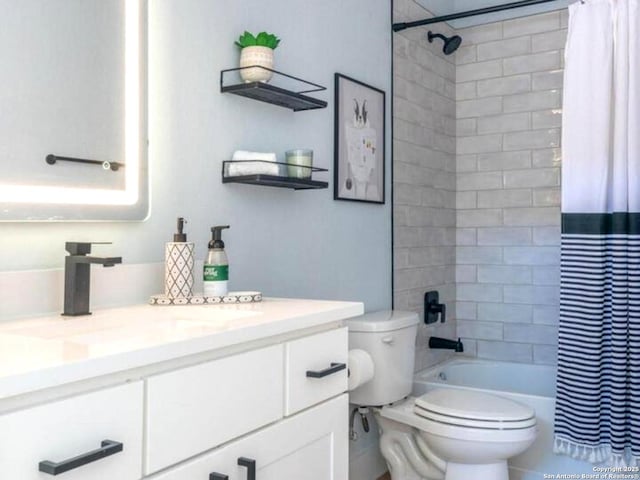 bathroom featuring vanity, toilet, and shower / tub combo