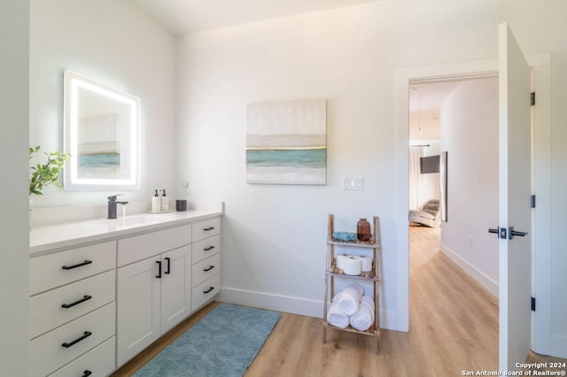 bathroom featuring vanity and hardwood / wood-style floors