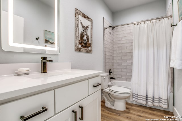 full bathroom with vanity, shower / bathtub combination with curtain, toilet, and wood-type flooring