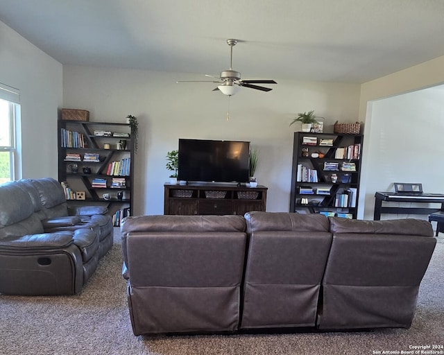 living room featuring ceiling fan and carpet flooring