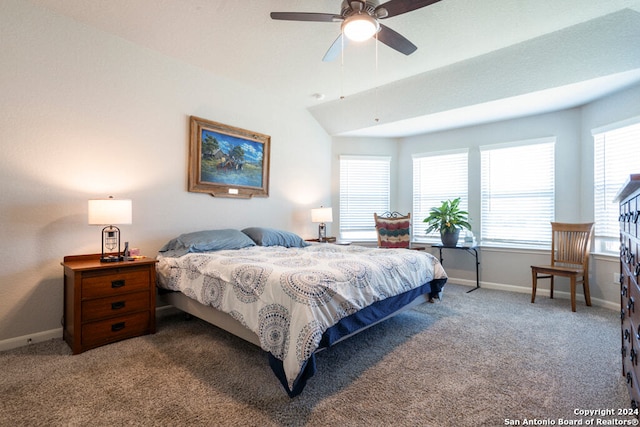 carpeted bedroom with vaulted ceiling and ceiling fan