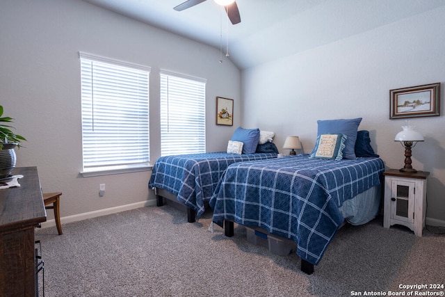 carpeted bedroom with vaulted ceiling and ceiling fan