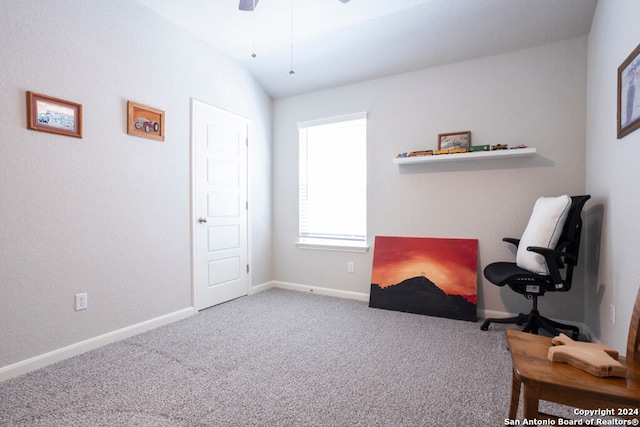 living area with ceiling fan, vaulted ceiling, and carpet