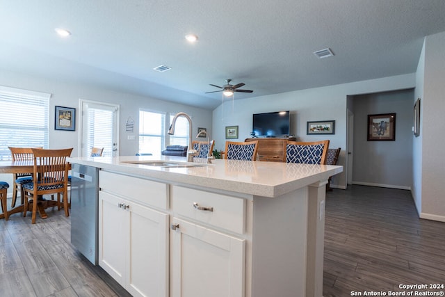 kitchen featuring white cabinets, a kitchen island with sink, hardwood / wood-style flooring, and sink