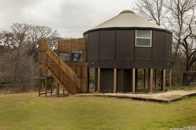 view of jungle gym with a yard and a wooden deck