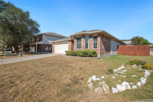 view of front of property with a front lawn and a garage