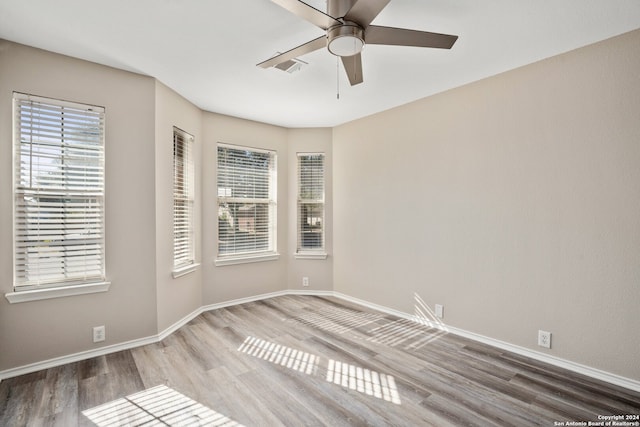 unfurnished room featuring hardwood / wood-style flooring and ceiling fan