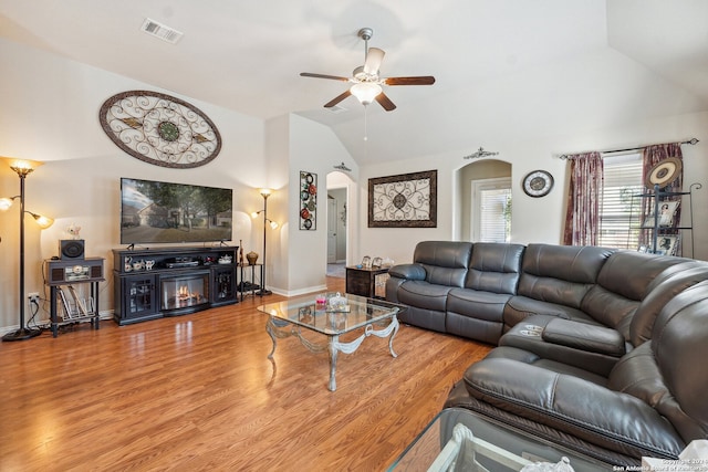 5018 Italica Rd, San Antonio, TX 78253 - living area featuring visible vents, a ceiling fan, lofted ceiling, wood finished floors, and arched walkways