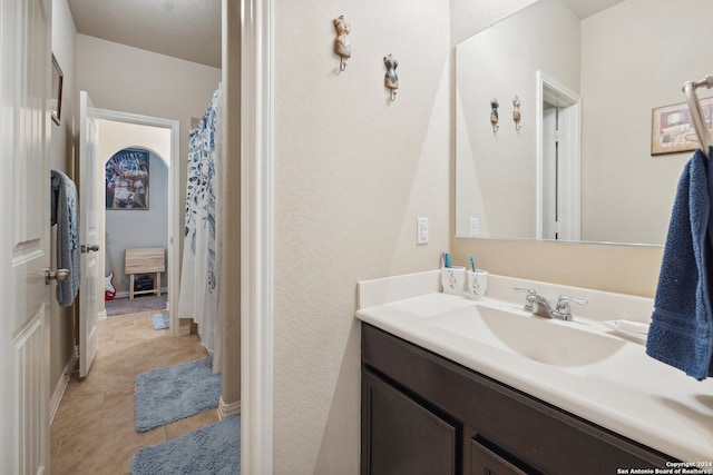 bathroom with vanity and tile patterned floors