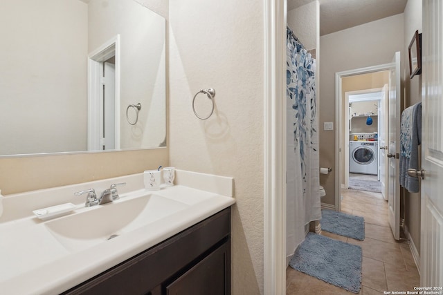 5018 Italica Rd, San Antonio, TX 78253 - bathroom with vanity, washer / dryer, tile patterned floors, and curtained shower