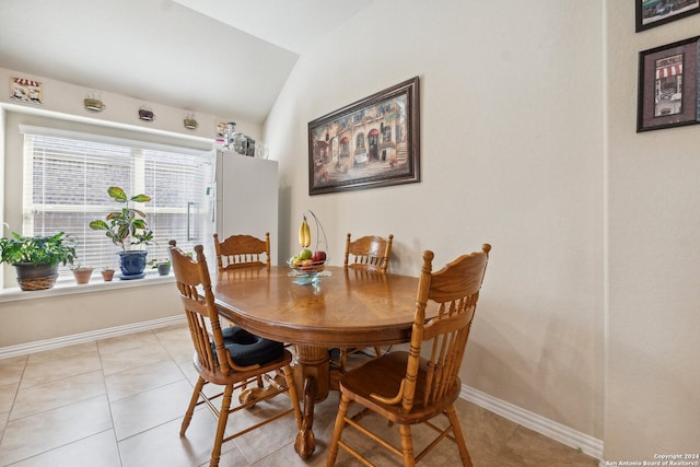5018 Italica Rd, San Antonio, TX 78253 - dining area featuring light tile patterned floors, baseboards, and vaulted ceiling