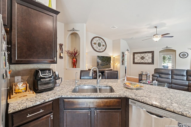 5018 Italica Rd, San Antonio, TX 78253 - kitchen featuring a sink, dishwasher, dark brown cabinets, and open floor plan