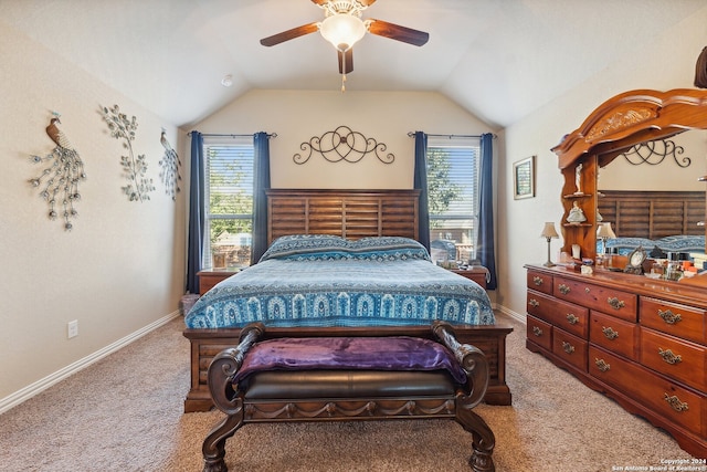 bedroom featuring lofted ceiling, multiple windows, and ceiling fan