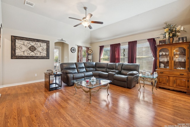 5018 Italica Rd, San Antonio, TX 78253 - living area with ceiling fan, arched walkways, light wood-style flooring, lofted ceiling, and visible vents