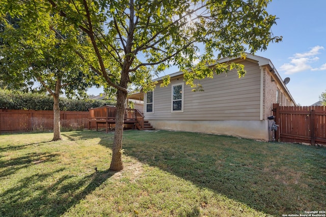 5018 Italica Rd, San Antonio, TX 78253 - view of side of home featuring a fenced backyard, a yard, and a deck