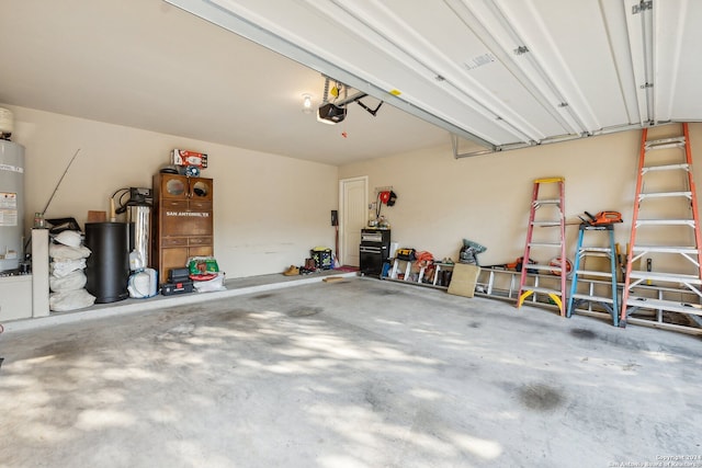 garage featuring a garage door opener and water heater