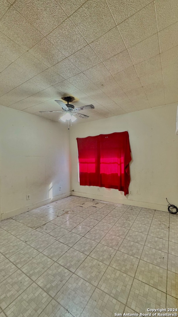 spare room featuring ceiling fan