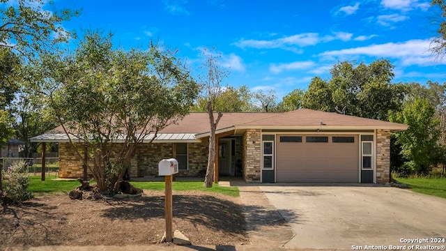 ranch-style home featuring a garage